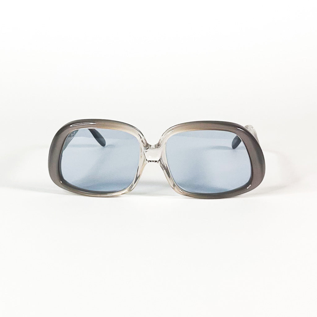 Lunettes de soleil vintage Lizon vue de face, monture transparente et verres bleus