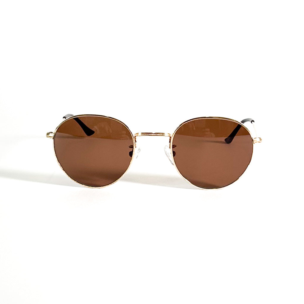 Lunettes vintage Morel vue en perspective avec monture ronde métal doré et verres teintés marron