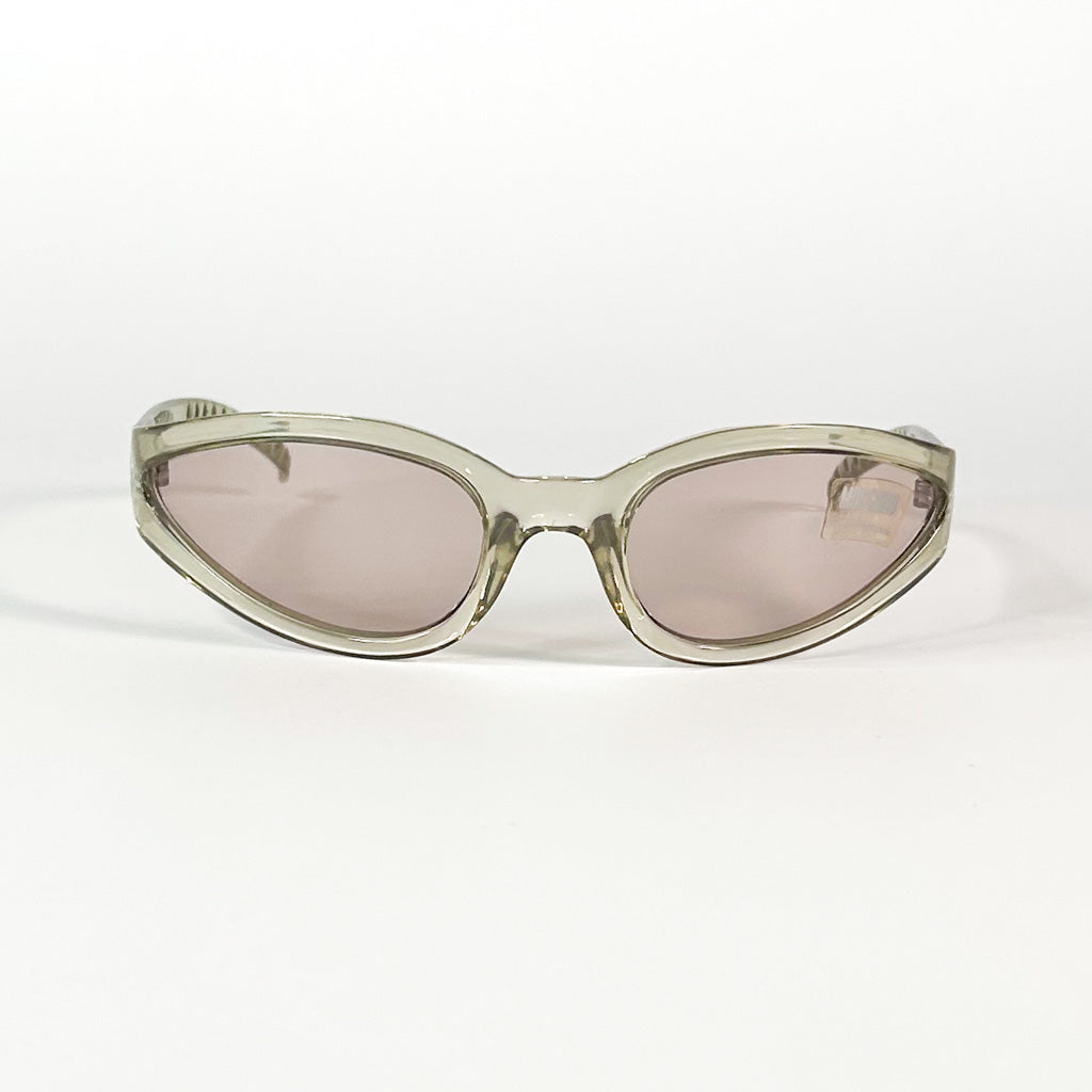 Monture Moschino vintage beige translucide, détail de la forme rectangulaire légèrement arrondie.