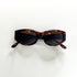 Lunettes Jean Patou vues de face – monture écaille marron foncé et verres teintés