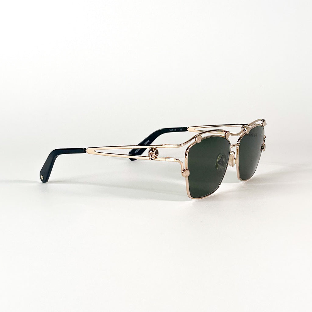 Vue de 3/4 des lunettes Philipp Plein – monture dorée et structure en double pont