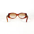 Vue frontale de lunettes de soleil vintage écaille avec monture épaisse et verres ovales
