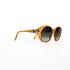 Vue profil gauche de la paire Christian Dior ambre, finitions CD