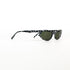Lunettes de soleil vintage œil-de-chat noires avec motif graphique, vue 3/4 avant