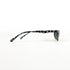 Lunettes de soleil vintage au design géométrique noir et blanc, vue de profil gauche