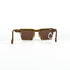 Vue en plongée des lunettes de soleil vintage Christian Lacroix 7318 avec branches repliées et monture en optyl brun translucide