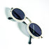 Vue plongeante des lunettes de soleil ovales Courrèges G100 monture ivoire