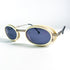 Plan rapproché lunettes de soleil Courrèges G100 monture ivoire et verres bleus