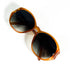 Vue de dessus de la paire Christian Dior ambre, branches croisées