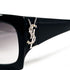Détail logo YSL strassé sur branche de lunettes Yves Saint Laurent vintage noires