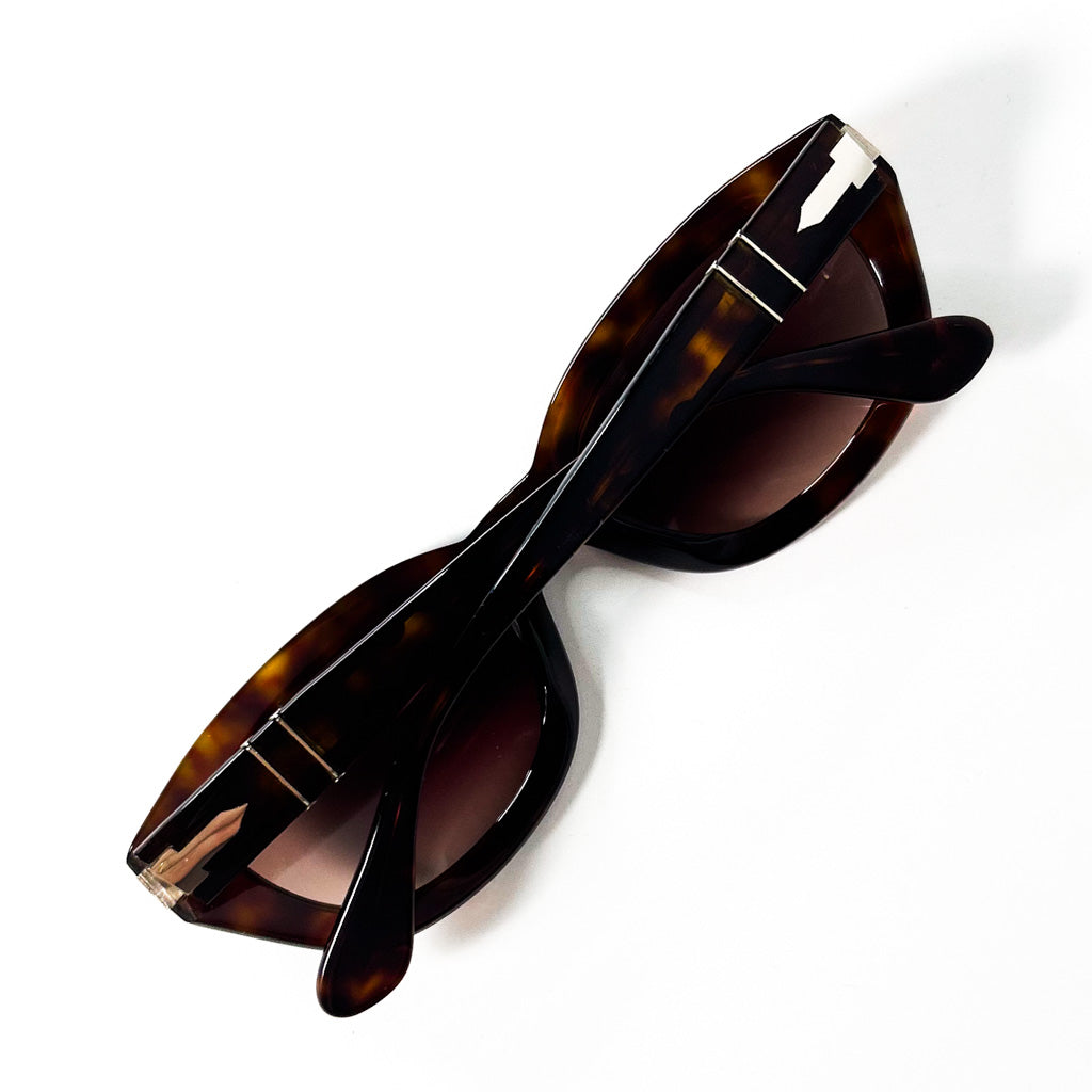 Lunettes Persol vintage repliées, flèches en métal visibles