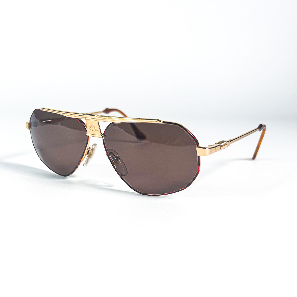 Lunettes Kappa 250 dorées avec verres marron foncé, logo visible