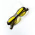 lunettes vintage pliées vue de dessus damier noir blanc verres jaunes