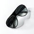 Lunettes de soleil D&G noires avec verres dégradés, vue de dessus.