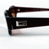 Détail logo Gucci sur branche Optyl marron