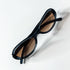 Monture ovale Prada SPR 04A 2AD-1A1 en acétate bleu avec verres bruns