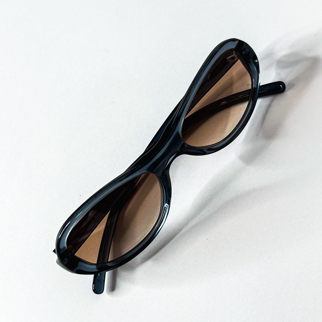 Monture ovale Prada SPR 04A 2AD-1A1 en acétate bleu avec verres bruns