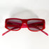 Vue de face des lunettes Gianfranco Ferré rouges avec une légère transparence du verre