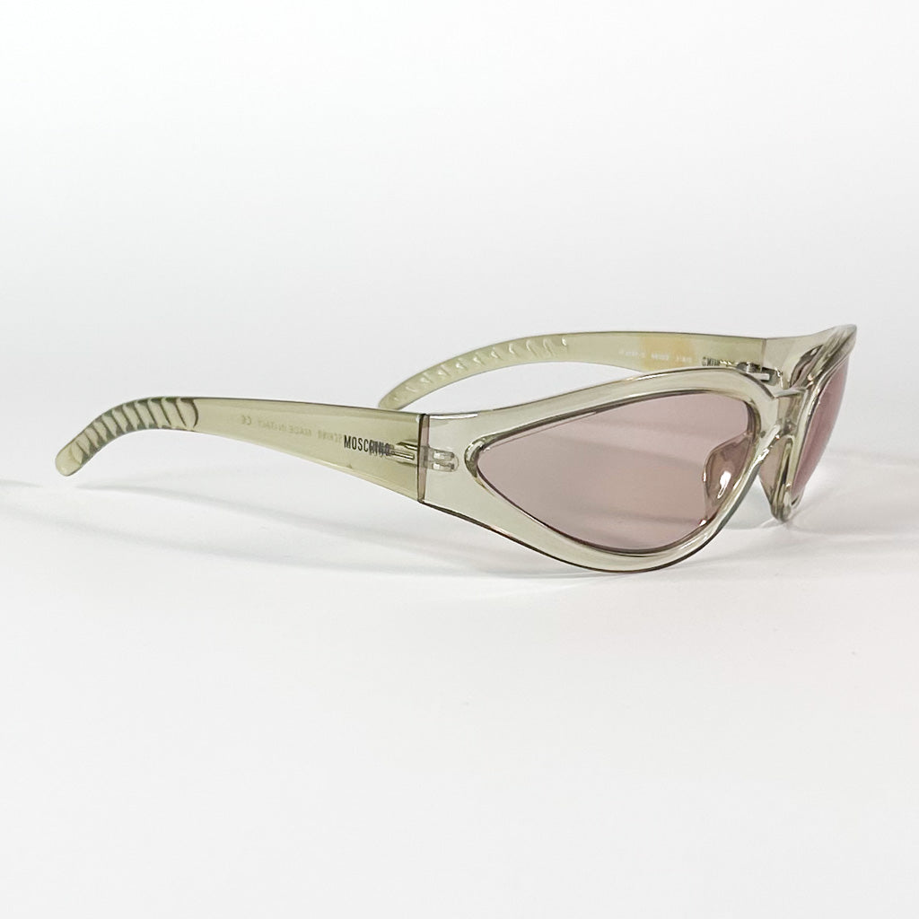 Vue de profil d’une monture Moschino vintage beige translucide sur fond blanc