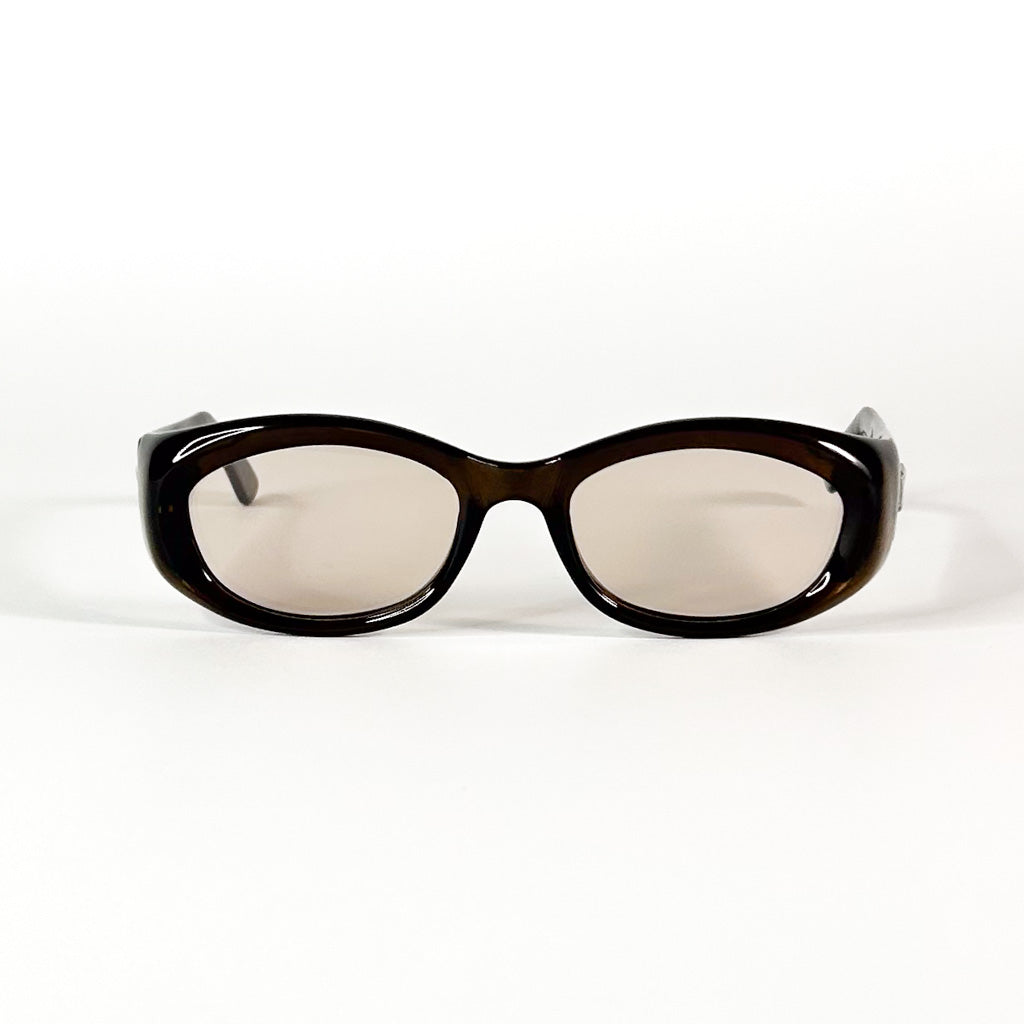 Vue de dessus des lunettes vintage Gucci en acétate marron translucide
