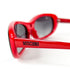 Détails monture acétate rouge noir avec petit cœur signature Moschino