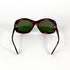 Lunettes de soleil vintage écaille marron verres verts pliées vue dessus
