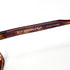 Lunettes de soleil Jean Lempereur vues de face, branches ouvertes, verres jaunes