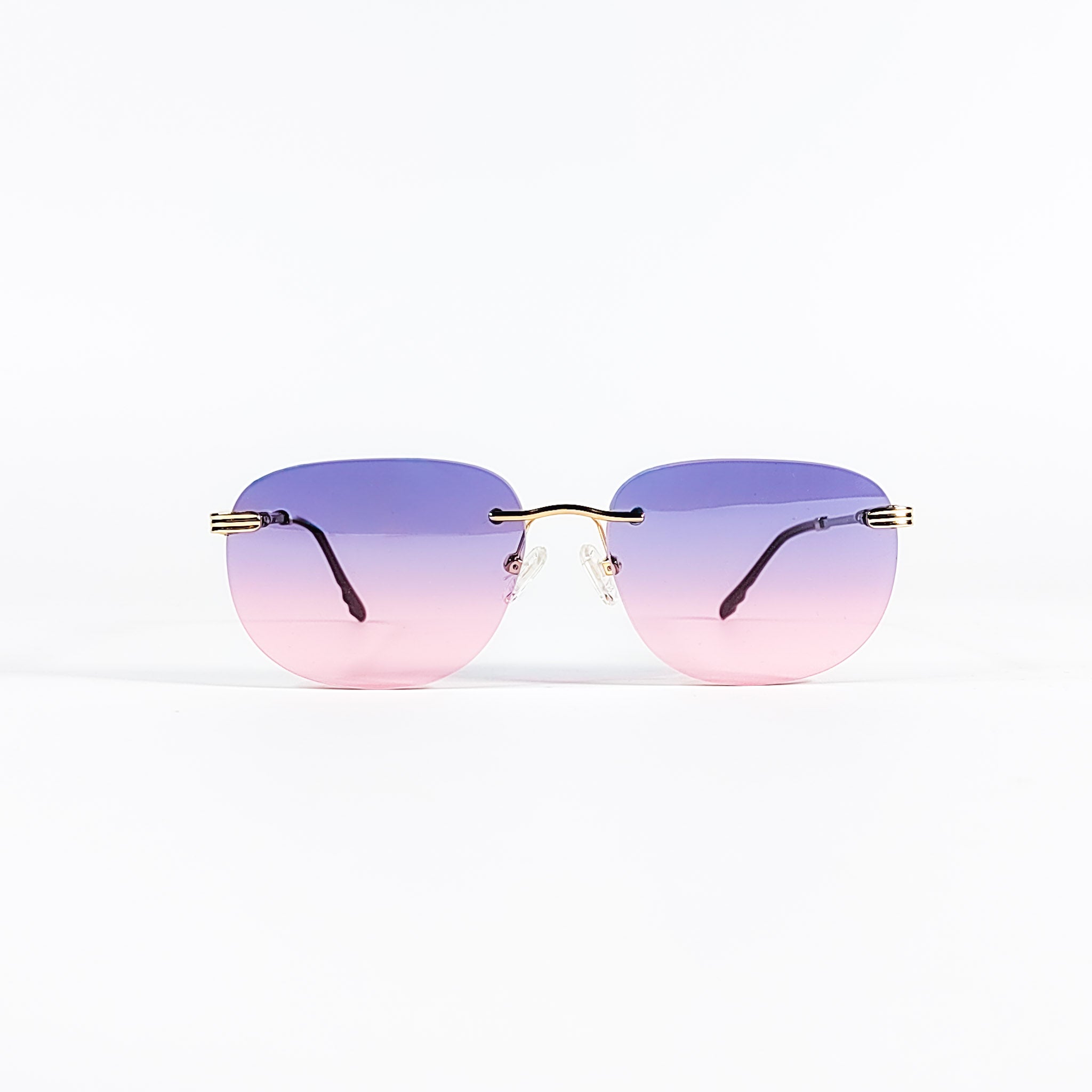 Lunettes de soleil vintage Porta Romana 1009 rimless métal doré, verres dégradés violet rose, vue de face centrée.