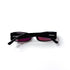 Vue dessus arrière lunettes Chanel 3102 pliées, lettrage CHANEL visible sur les deux branches