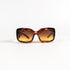 Lunettes de soleil vintage Chanel 5076-H vue de face, acétate écaille brun roux et verres dégradés ambre miel.