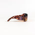 Chanel 5076-H de profil, monture wraparound oversize écaille et incrustation nacre sur la branche.