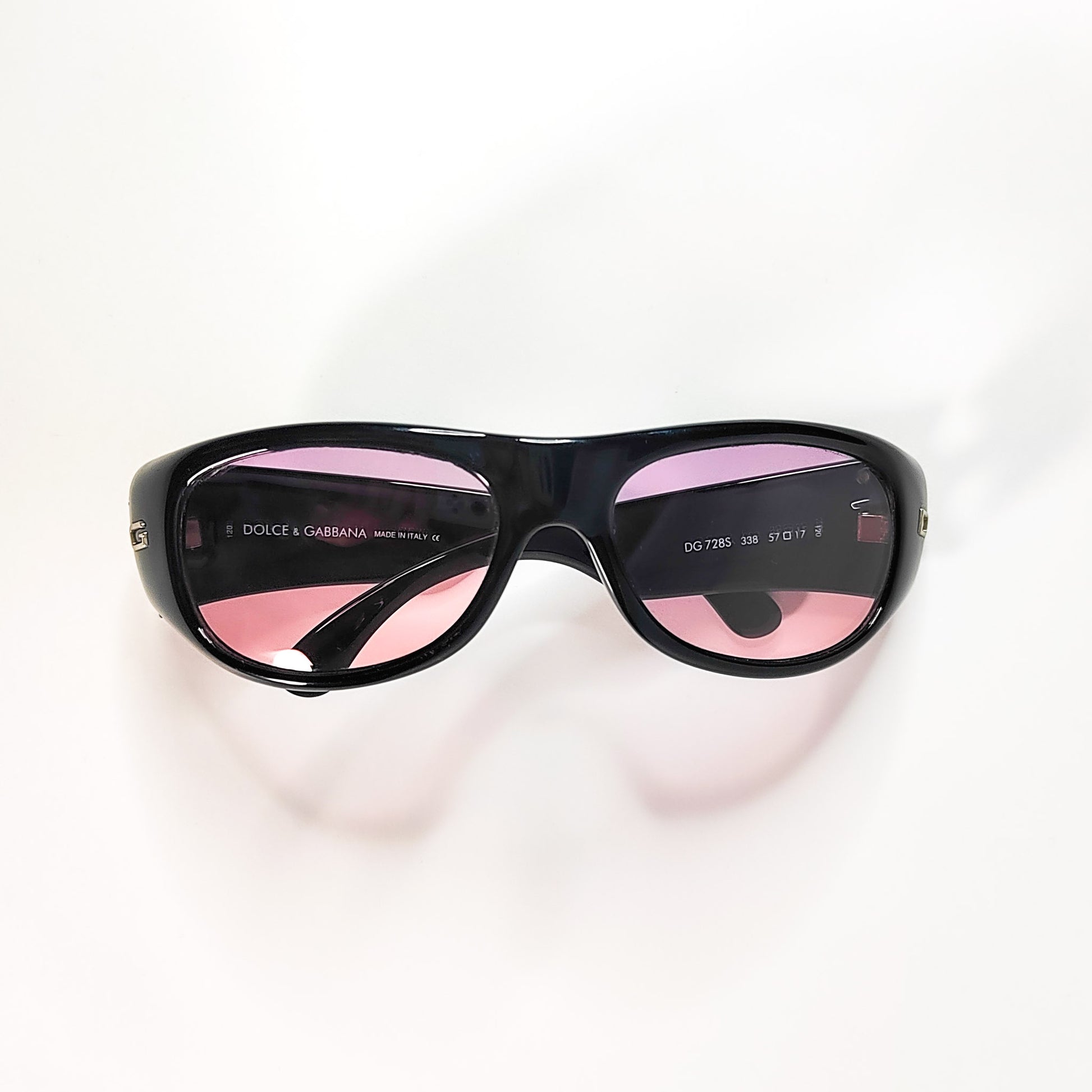 Dolce & Gabbana DG 728S vue de dessus, ouverte à plat avec verres rose et inscriptions visibles