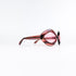 Lunettes de soleil Sevima vintage vue trois-quarts, monture losange acétate rose et brun verres teintés