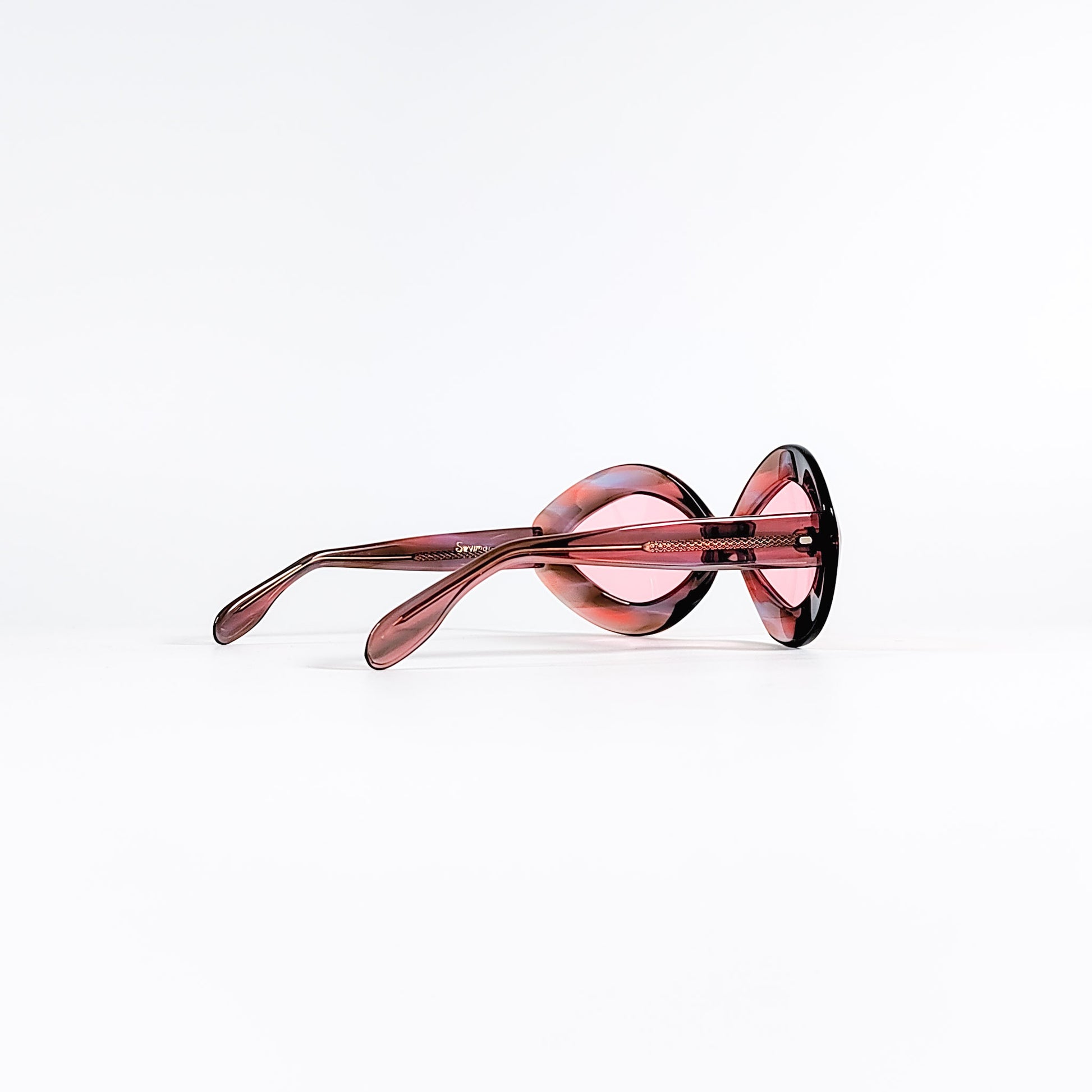 Lunettes de soleil vintage Sevima vue trois-quarts arrière, monture acétate des années 70 verres roses