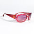 Vue 3/4 face lunettes Chanel 5022 c.600, acétate rouge framboise translucide et verres rose dégradé, logo CC doré visible